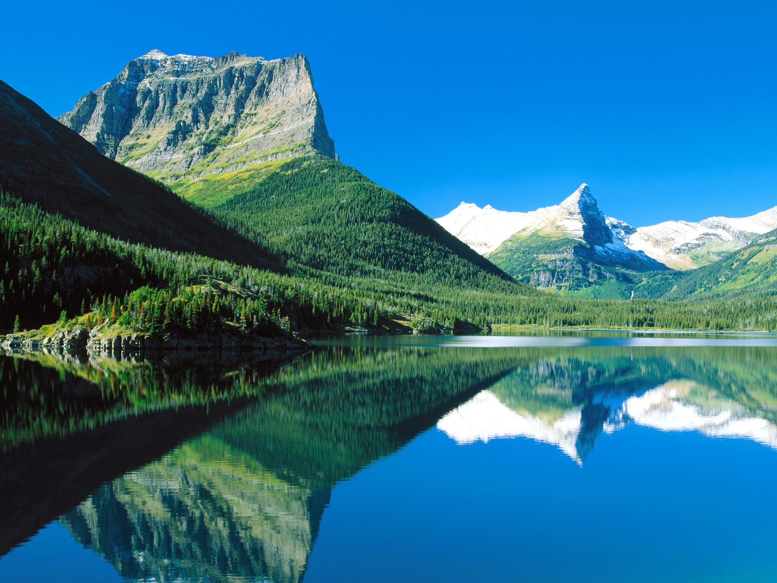Mountains_Mirrored_St._Mary_Lake_Glacier_National_Park_Montana.jpg